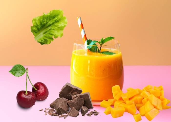 Anti-Aging Smoothie with Mango, Cherries and Green Leaves